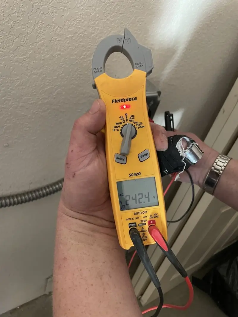 Voltage testing with clamp meter during Outlet Installation in Clawson